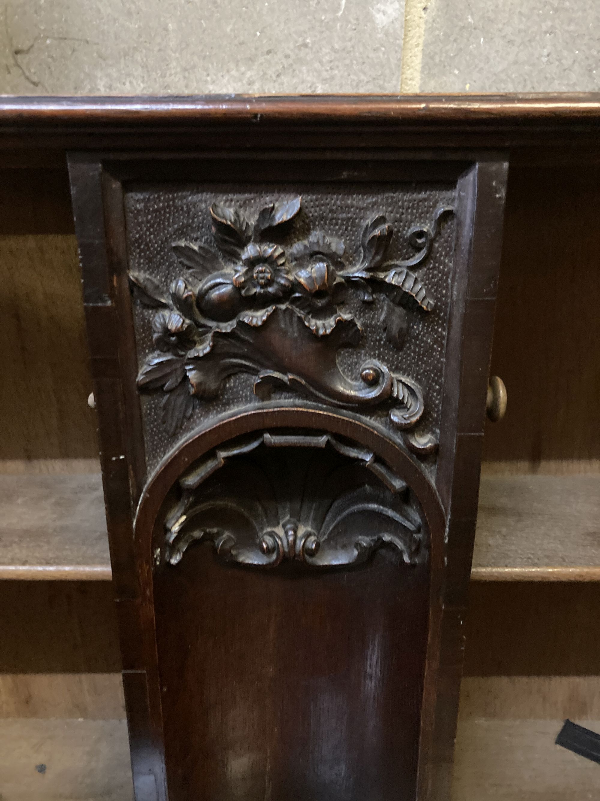 An 18th century style carved oak two door wall cabinet, with concealed central compartment, width 80cm, depth 19cm, height 50cm
